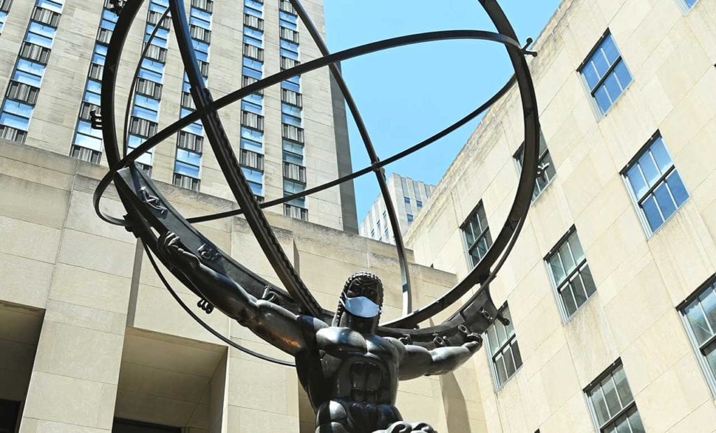 The Atlas bronze statue in Rockefeller Center wearing a mask.
