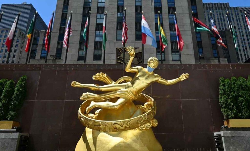 The Prometheus bronze statue in Rockefeller Center wearing a mask.