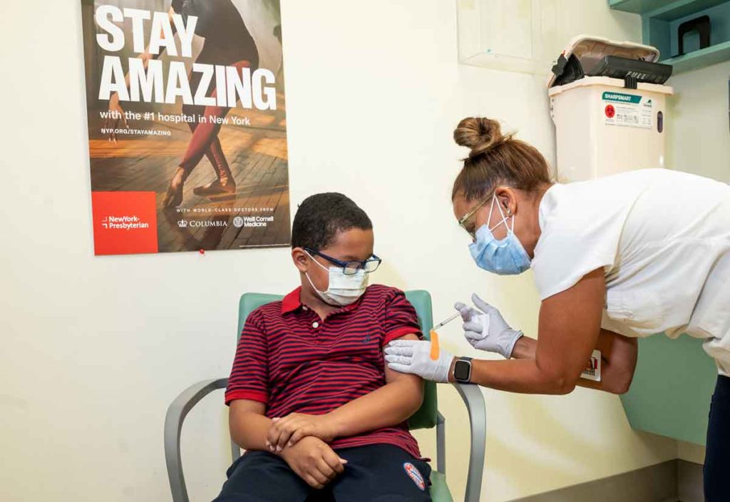 A child receiving the COVID-19 vaccine at NewYork-Presbyterian hospital
